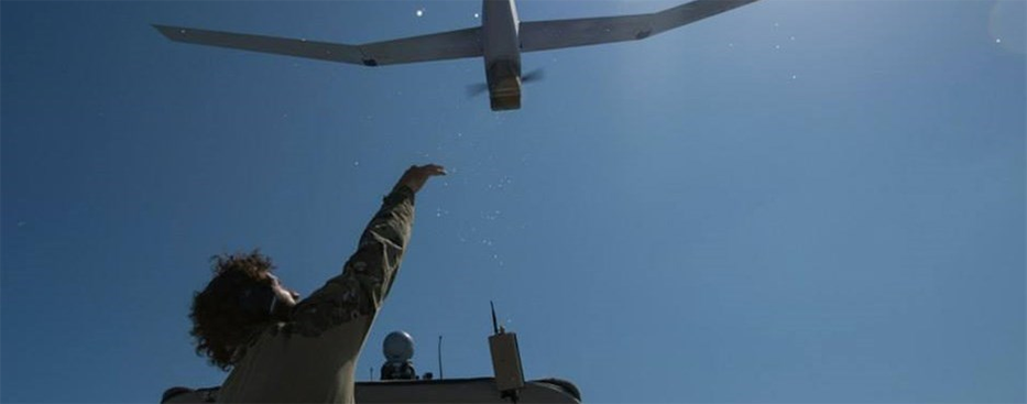 a man launches a drone
